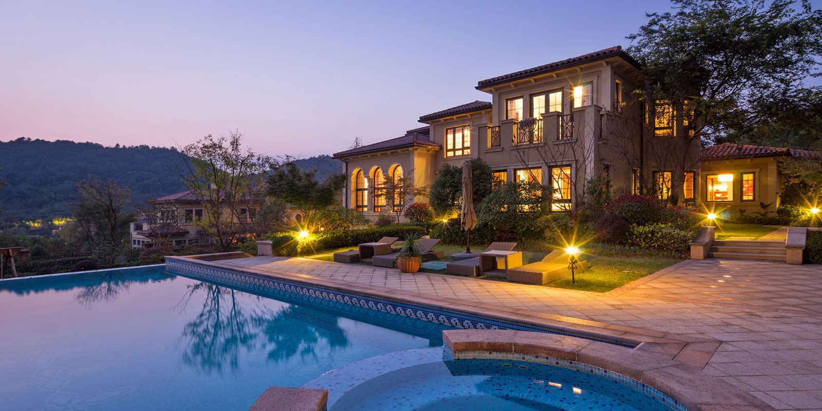 Spanish Style Mansion with Infinity Pool in Dusk