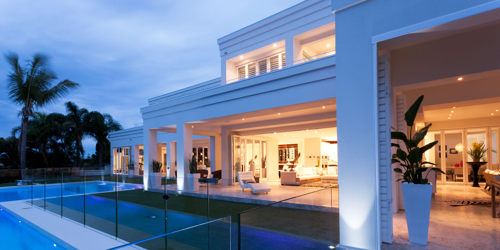 White Mansion With Patio and Pool