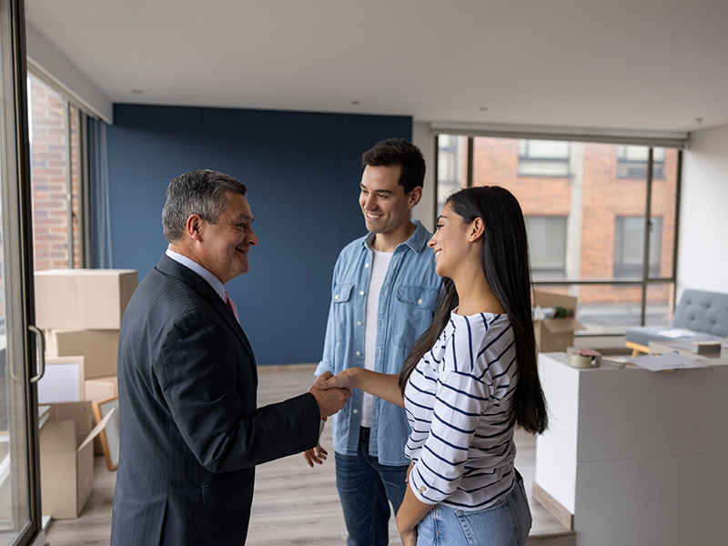 couple talking with real estate agent